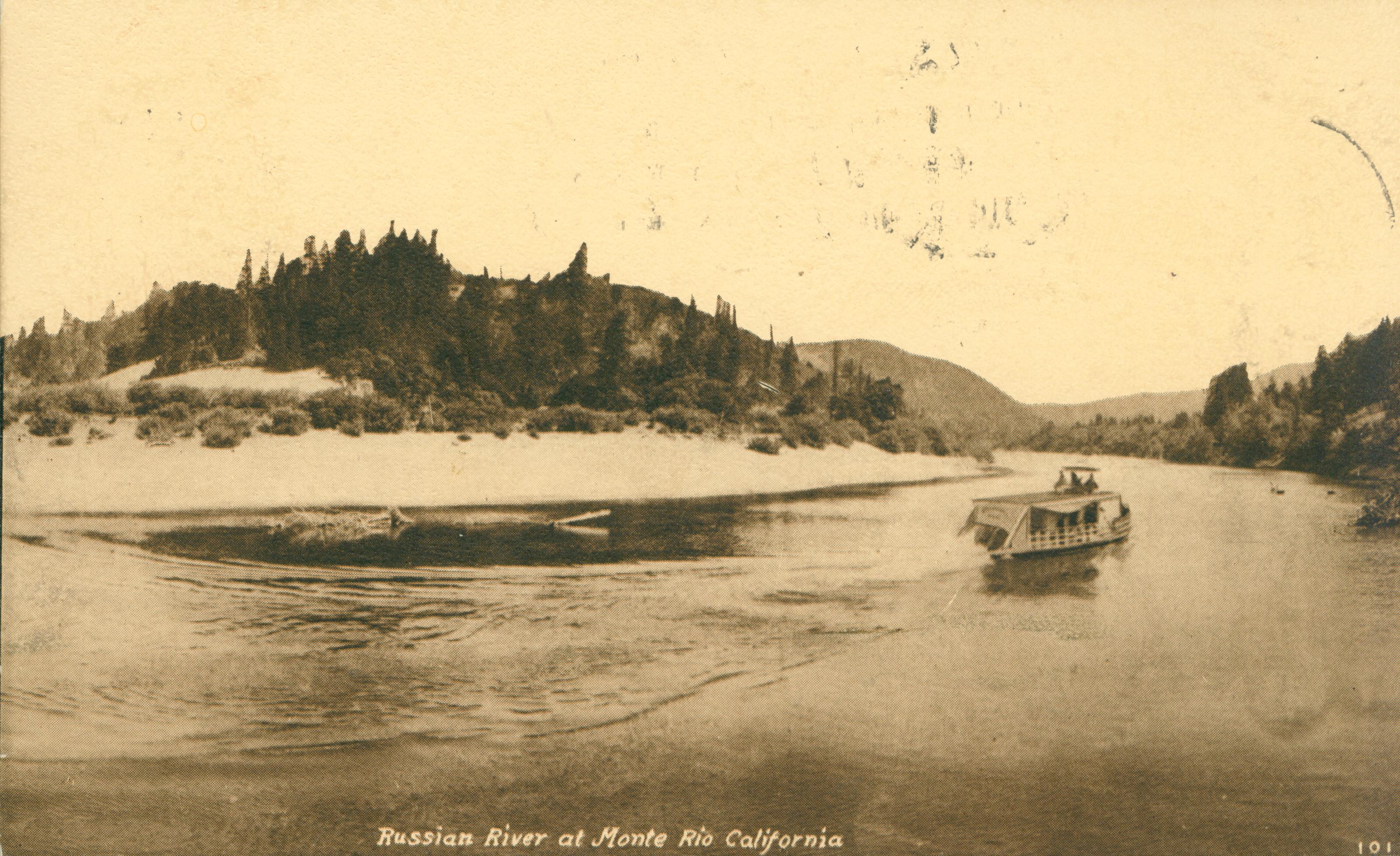 Shows a bend in the Russian River with a beach on the far show and a ferry underway